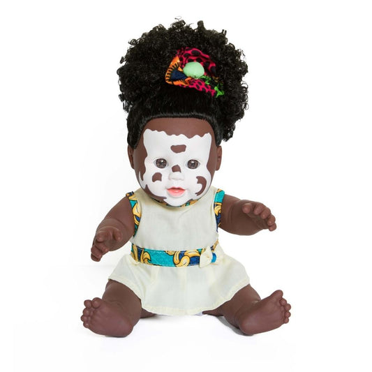 Baby doll with vitiligo skin and black hair 